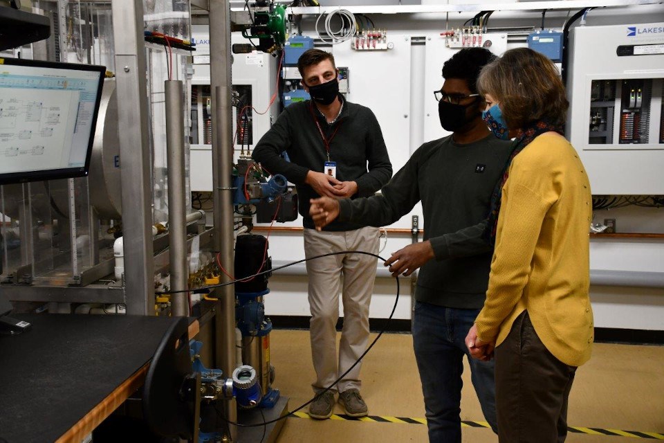 Student Sachin Raj Sampath (centre) demonstrates instrumentation equipment for Confederation College President Kathleen Lynch and Lakeside Team Lead of Regional Services Chris Foulds. Student Sachin Raj Sampath (centre) demonstrates instrumentation equipment for Confederation College President Kathleen Lynch and Lakeside Team Lead of Regional Services Chris Foulds.